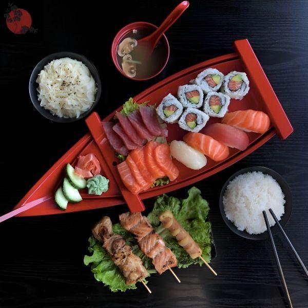 Soup, Salad, Rice, 6 California Maki, 10 assorted sashimi, 4 assorted sushi, 3 skewers: 1 Chicken, 1 Salmon, 1 Beef Cheese